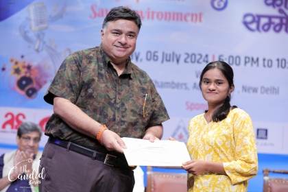 Scholarship ceremony — student receiving certificate